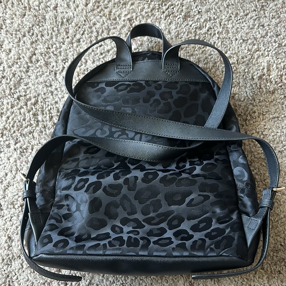 Used Michael Kors black canvas backpack. Black with black leopard spots. - Picture 2 of 5